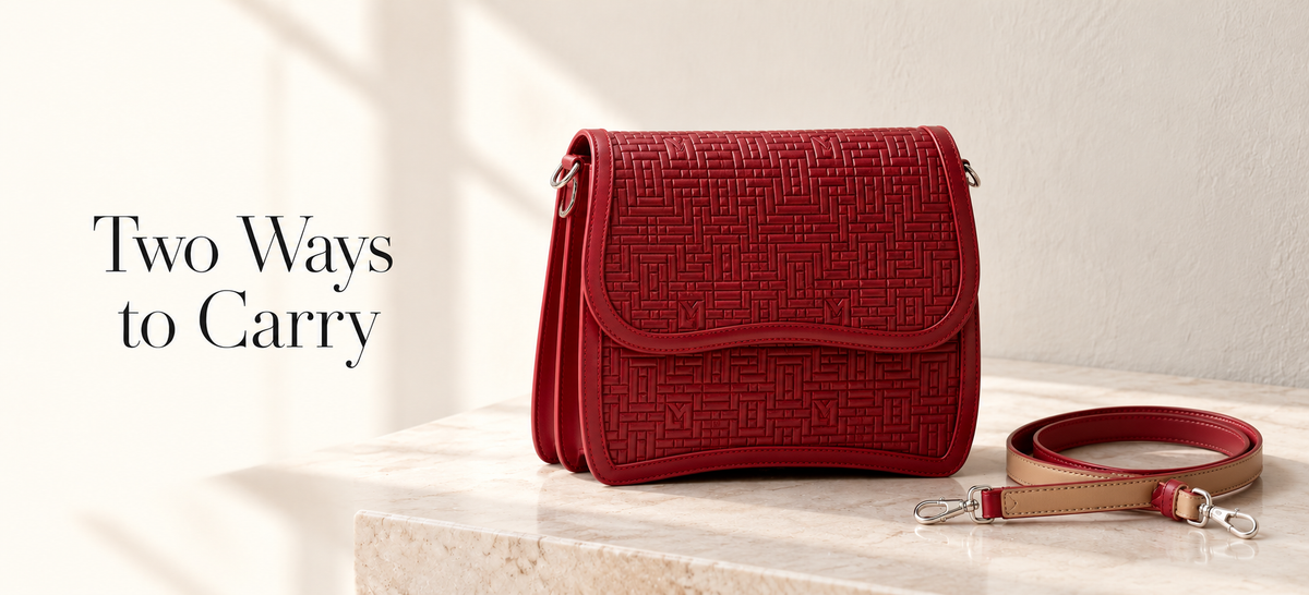 Red TALAWA leather handbag with its detachable tan-and-red strap alongside, beside the words “Two Ways to Carry”.